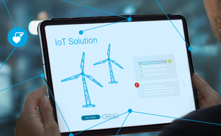 Keyvisual IoT: Man looking at a tablet with networked wind turbines