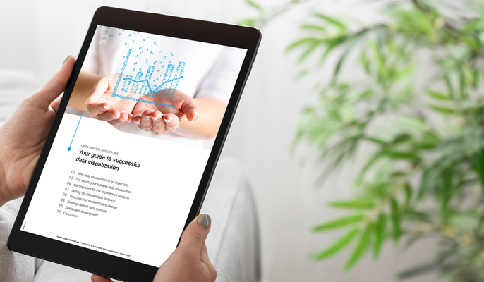 Person holding a tablet displaying a page about predictive maintenance and IoT content.